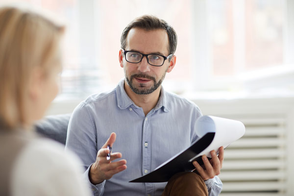 Woman with therapist during psychological testing